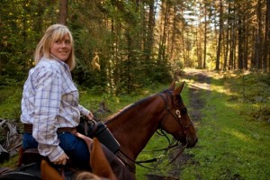 Cheryl & Dakota lead the ride at Tod Mountain Ranch