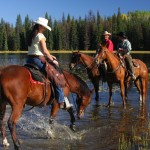 wranglers on horses at free rein guest ranch