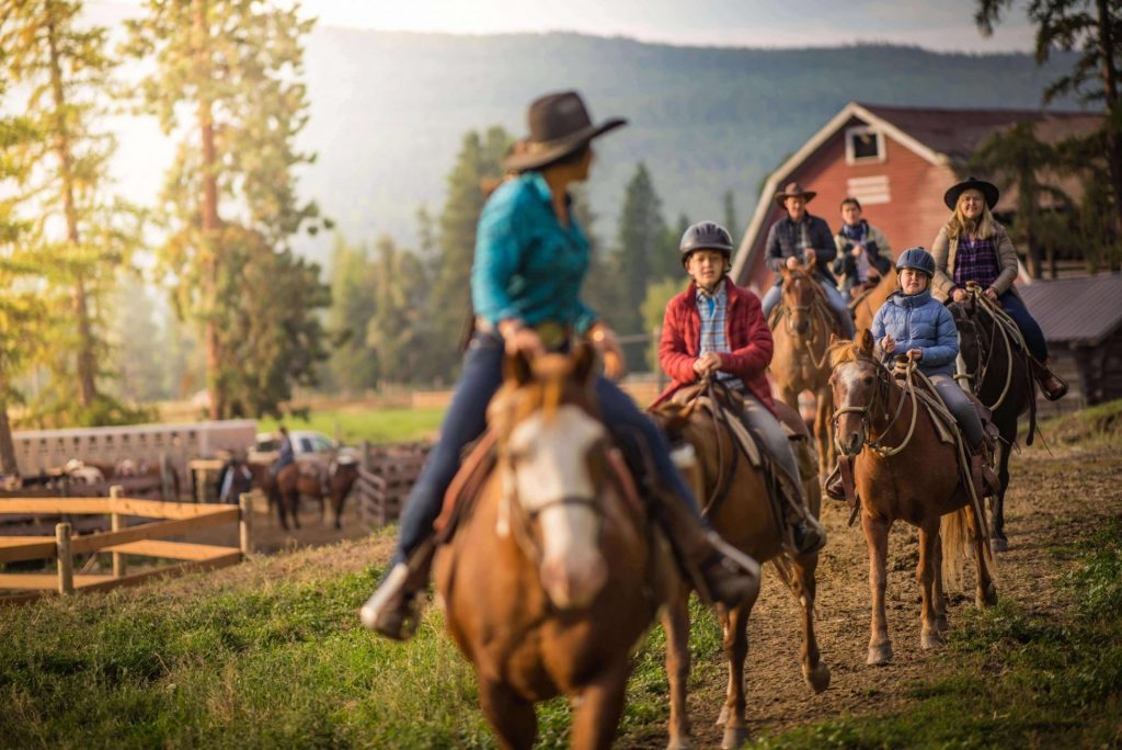 family on horses at ranch